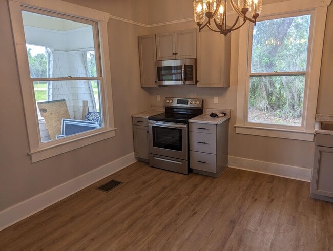 Building Photo - Relax on the front screened porch!