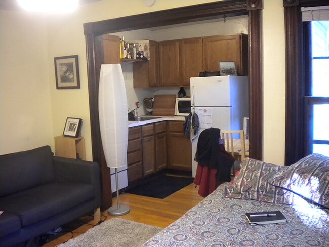 Living area and kitchen - 522 N Division St Apartments