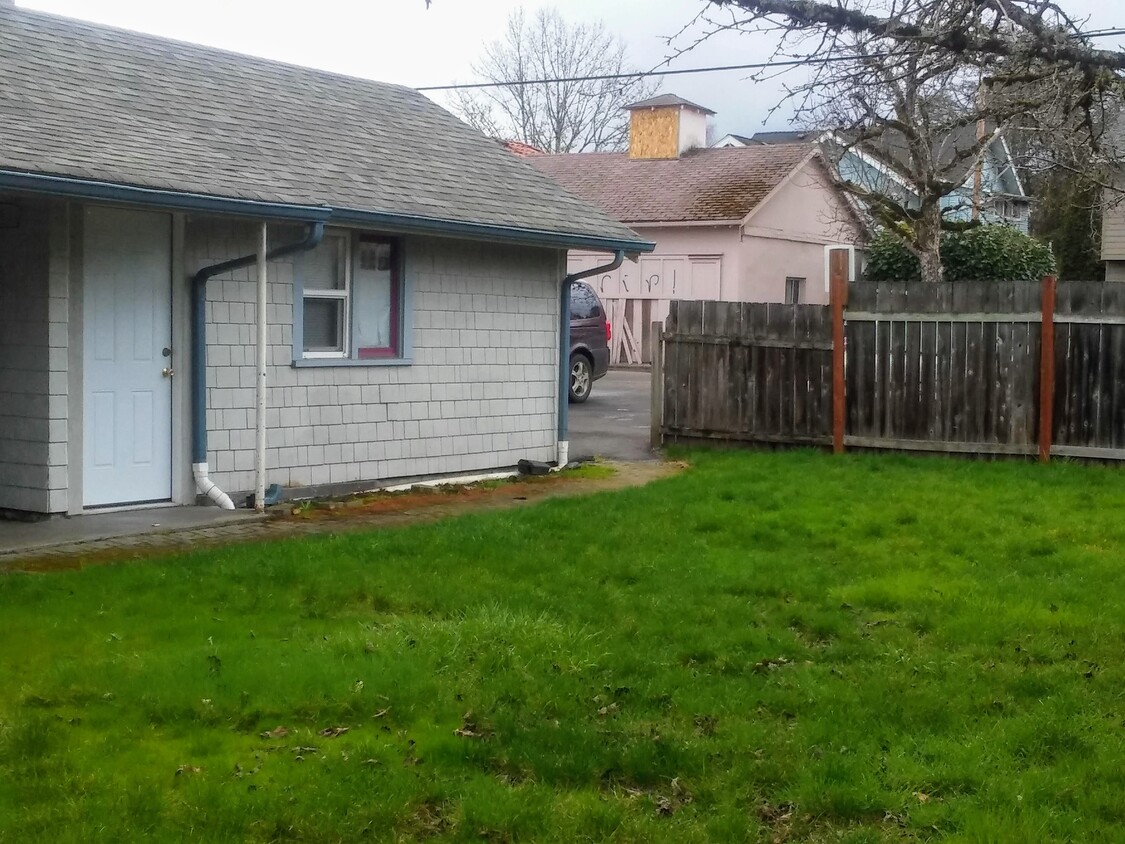 Backyard looking toward parking area - 308 NW Kings Blvd