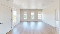This contemporary 2-bedroom apartment in Fargo, North Dakota, offers 1020 square feet of well-designed living space. The interior is characterized by its bright and airy atmosphere, enhanced by large windows that flood the rooms with natural light and provide scenic views of the surrounding area.

The kitchen is a standout feature, boasting modern stainless steel appliances, including a side-by-side refrigerator with water dispenser, and ample cabinet space with sleek, light-colored finishes. A distinctive geometric tile backsplash adds visual interest, while the open layout seamlessly connects to the living area.

The living room is spacious and versatile, with hardwood flooring that extends throughout the main living areas. Large windows with adjustable blinds offer control over light and privacy. The bedrooms, including the 160 square foot primary bedroom, feature plush carpeting for comfort underfoot.

The apartment's design incorporates both open spaces and defined rooms, creating a balanced flow throughout. Built-in closets provide ample storage, and the neutral color palette allows for easy personalization. Recessed lighting and modern fixtures contribute to the overall contemporary aesthetic of this well-appointed Fargo residence.