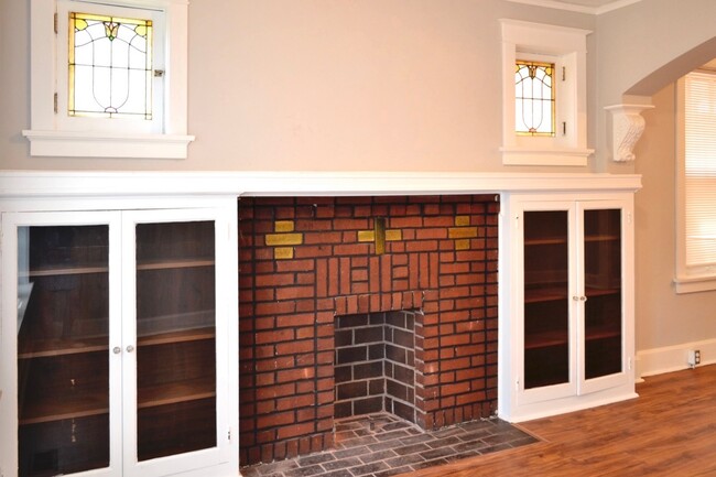 Stained glass windows, built in bookcases, decorative fireplace - 4919 Murdoch Ave