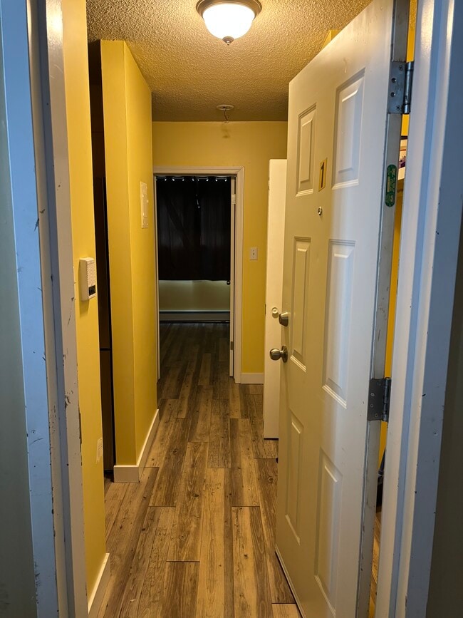 Hallway when entering the front door New renovations - 15940 109 Av NW