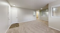 Located at 3600 Park Lake Ln in Peachtree Corners, GA, this well-appointed single-floor residence offers 1 bedroom and 2 bathrooms within a thoughtfully designed layout. The combined living and dining area provides a versatile, open feel, finished with neutral-toned carpet and a large wall mirror that enhances the sense of space. Multiple windows fitted with blinds bring in natural light throughout. The galley-style kitchen is a functional highlight, featuring white shaker cabinetry, granite countertops, stainless steel appliances including a refrigerator and electric range, and wood-look flooring that adds warmth and durability. A dedicated laundry room with a full-size washer and dryer adds everyday convenience. The spacious primary bedroom features soft carpeting, multiple windows, and generous closet access, while the two bathrooms are finished with granite vanity countertops, white cabinetry, and wood-look flooring. One bathroom includes a full tub and shower surround. Three closets throughout the unit provide ample storage. A private balcony and a utility room round out the functional offerings of this well-organized residence.