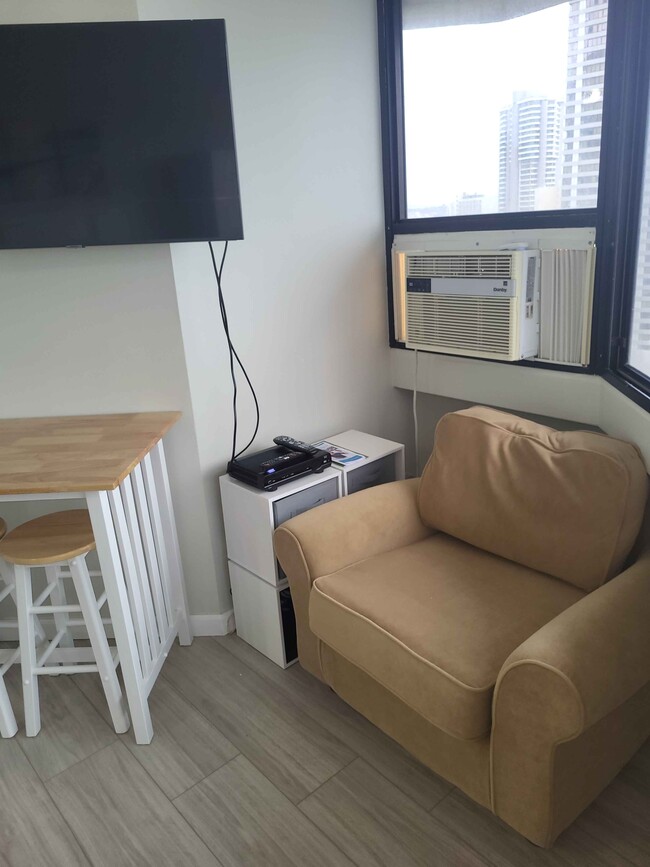 New TV and breakfast table. - 1770 Ala Moana Blvd