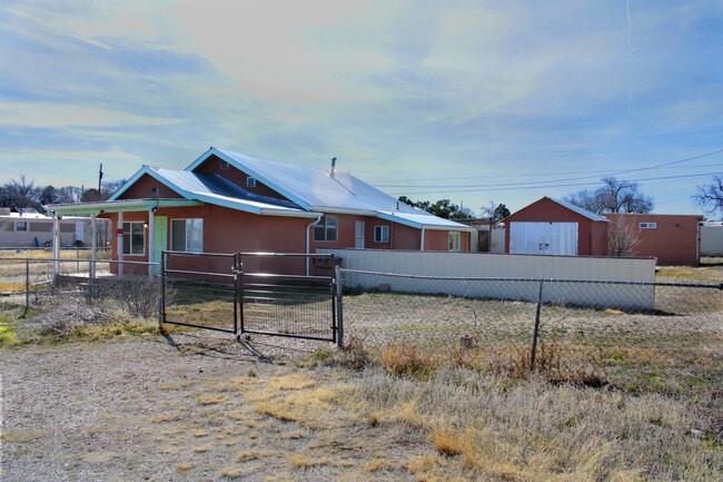 Yard is entirely fenced, with 3 locking gates - this is the drive-through entrance - 301 Sunset Ave N