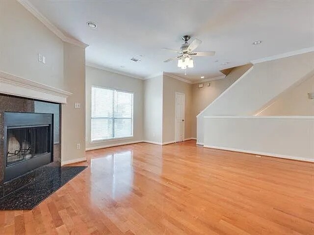 Living Room with view of half bath and upstairs - 2407 Stutz Dr