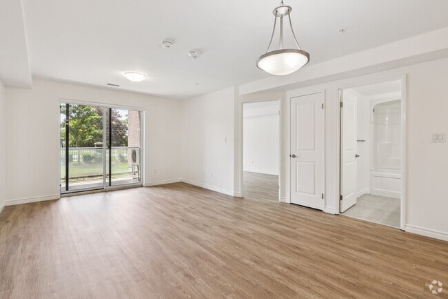 1BR, 1BA - 786SF - Living Room - 220 Ira Needles Blvd