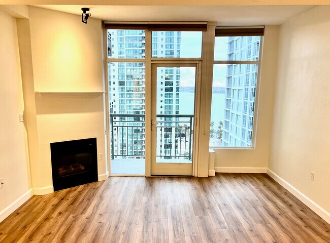 After renovation, living area with gas fire, private balcony and views - 1240 India St