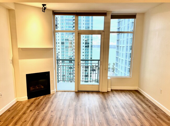 After renovation, living area with gas fire, private balcony and views - 1240 India St