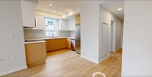 This 670 square foot apartment in Richmond offers a thoughtfully designed living space with two bedrooms and one bathroom. The open-concept layout features a modern kitchen with light wood cabinetry, stainless steel appliances, and a sleek design that maximizes functionality. Large windows throughout flood the space with natural light, creating an airy and inviting atmosphere.

The primary bedroom, measuring 130 square feet, provides ample space for relaxation. Both bedrooms feature light-colored walls and wood-look flooring, contributing to a clean and contemporary aesthetic. The bathroom showcases a marble-inspired tile floor, a combination tub and shower, and a floating vanity, reflecting attention to both style and practicality.

The living area seamlessly connects to the kitchen, ideal for entertaining or everyday living. Floor-to-ceiling windows in the main living space offer expansive views of the surrounding cityscape, adding to the apartment's sense of openness. Throughout the unit, neutral tones and minimalist design elements create a canvas for personal expression.

Located at 501-3600 Sexsmith Road, this apartment combines urban convenience with modern comfort, making efficient use of its 670 square feet to deliver a stylish and functional living environment.