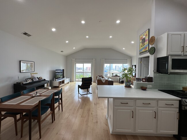 Living Room with 12-foot Vaulted Ceilings - 122 Ogden Ave