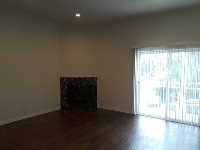 Living room fireplace & balcony - 2436 Barry Ave