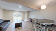 Located at 1378 Stratford Dr in Kent, Ohio, this single-floor, one-bedroom, one-bathroom unit offers a thoughtfully designed layout with a neutral, modern aesthetic. Light hardwood-style flooring runs continuously throughout, lending warmth and visual cohesion to the entire space.

The combined living and dining area forms the heart of the unit, with the living room anchored by a sliding glass patio door that fills the space with natural light and provides outdoor views of a grassy landscape. A built-in ledge detail adds architectural interest to the living area. The dining space is distinguished by a white subway tile accent wall and a globe pendant light, creating a defined and stylish setting.

The kitchen features warm wood cabinetry, granite-style countertops, stainless steel appliances including a refrigerator and dishwasher, and a peninsula that opens toward the main living area. In-unit laundry access and a louvered closet door add functional convenience.

The bedroom is a comfortable, quiet retreat with a louvered closet. The bathroom includes a single-sink vanity with granite-style countertops, white cabinetry, and a full tub-shower combination with a clean surround. Recessed lighting throughout completes the polished, move-in-ready feel.