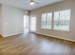This contemporary 650 square foot apartment in Kissimmee, FL, offers a harmonious blend of style and functionality. The open-concept design creates a spacious feel, with the kitchen, living room, and dining area flowing seamlessly together. The heart of the home is the modern kitchen, boasting white cabinetry, stainless steel appliances, and a convenient island that doubles as a breakfast bar.

The living area is bathed in natural light, thanks to large windows and a glass door leading to a private balcony. A modern ceiling fan enhances air circulation and comfort. The bedroom, measuring 150 square feet, provides ample space and features double windows for plenty of daylight.

The bathroom is sleek and efficient, with a single vanity and modern fixtures. A walk-in closet offers generous storage space with wire shelving systems. Throughout the apartment, neutral color tones create a calm ambiance, while the warm hardwood flooring adds a touch of elegance.

Energy-efficient appliances, including a washer and dryer, complete this well-designed living space. The apartment's layout maximizes every square foot, making it an ideal choice for singles or couples seeking a comfortable, low-maintenance lifestyle in a prime Kissimmee location.