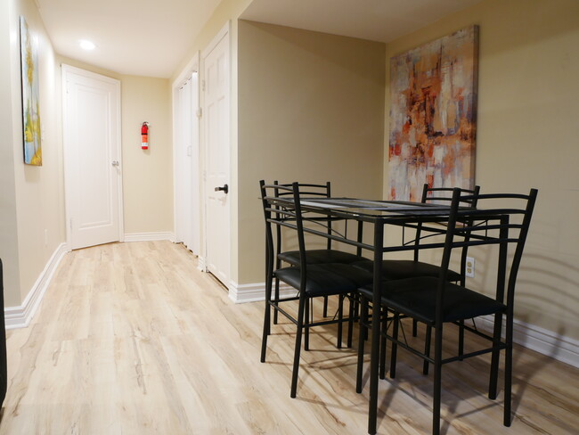 Dining table and hall to bedroom - 11651 W Layton Dr