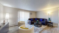 Located at 7100 E Mississippi Ave in Denver, Colorado, this one-bedroom, one-bathroom residence offers a thoughtfully laid-out single-floor plan making efficient use of every square foot. The entryway, finished with wood-look flooring, opens into a welcoming living area featuring a textured ceiling, large vertical-blind-covered sliding doors that invite natural light, and a secondary living space that provides flexibility for a sitting room or home office.

The kitchen is equipped with gray shaker-style cabinetry, light stone countertops, a stainless steel sink, and wood-look flooring, complemented by a dedicated pantry for additional storage. An adjacent dining room offers a defined space for meals. The unit also features a private balcony, ideal for enjoying the Colorado outdoors.

The carpeted bedroom is generously proportioned, offering a built-in open closet, multiple windows with blinds for natural light, and a quiet, restful ambiance. Two additional closets throughout the unit provide ample storage. The full bathroom includes a tub-shower combination with a light tile surround, a gray vanity with a light stone countertop, and wood-look tile flooring. With three total closets and a practical, comfortable layout, this residence offers functional living in a convenient Denver location.