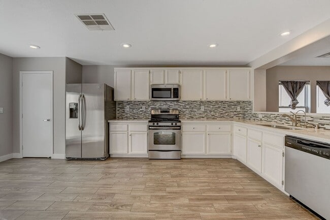 Building Photo - Totally Updated Solar Powered 4 Bedroom! Bedroom and Bath Downstairs!