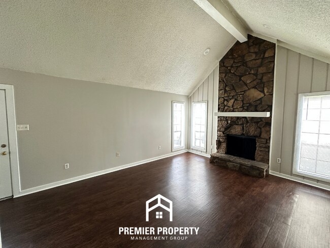 Building Photo - Beautiful 3BR/2BA Near Southwind | Soaring Vaulted Ceilings, Fireplace & Fenced Yard