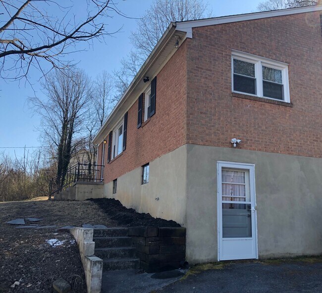Exterior door for access to storage and washer/dryer in lower level - 715 Riverland Rd SE