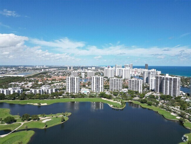 Building Photo - 3675 N Country Club Dr