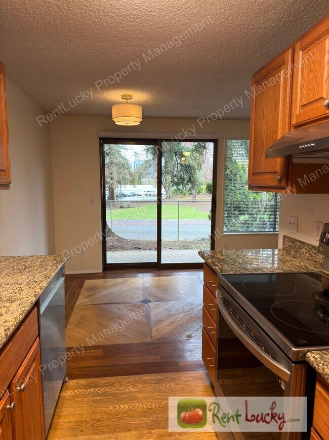 Building Photo - NEW Pricing! Amazing 1 Bedroom Kirkland Condo! Covered Parking and Outdoor Storage!
