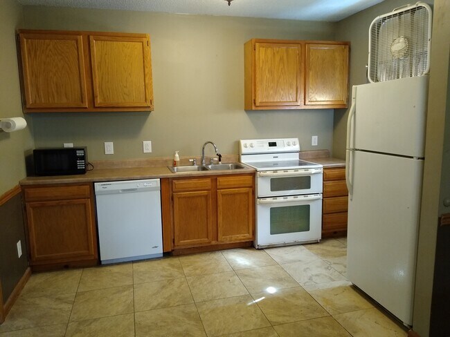 Kitchen area with dishwasher and microwave - 122 N Hayden St