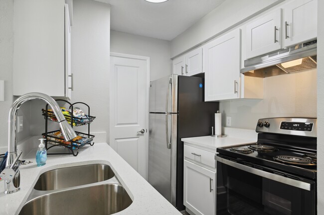 Kitchen w/ White Cabinetry - Bay Crossing