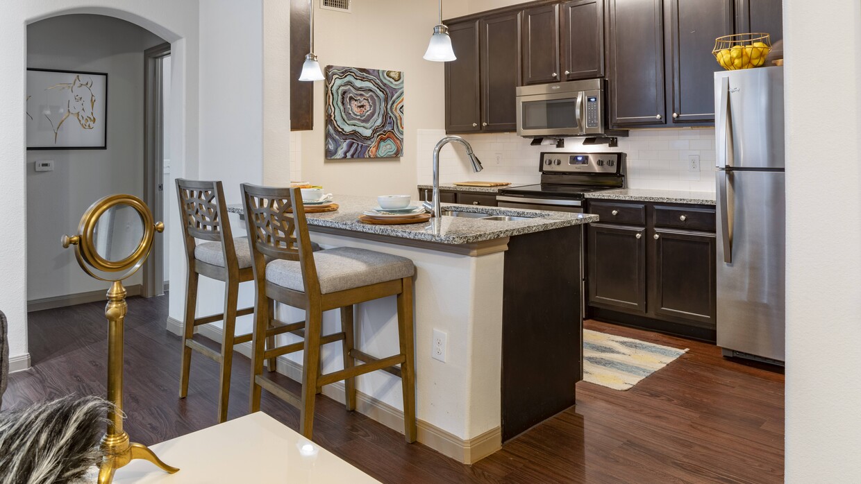 A kitchen perfect for whipping up gourmet meals in - West Creek Apartments