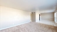 Located at 5606 Bissonnet St in Houston, TX, this single-floor, 2-bedroom, 2-bathroom unit offers a practical and comfortable layout. The open living and dining area features neutral beige carpet, soft warm-toned walls, and large windows fitted with horizontal blinds that allow generous natural light to filter in. The space flows into a tiled hallway that connects the main living areas to the rest of the unit.

The kitchen is well-appointed with gray cabinetry, granite-style countertops, a stainless steel double sink, and a classic white subway tile backsplash. Marble-look tile flooring adds a clean, modern touch, and a pantry provides additional storage.

The primary bedroom is a spacious retreat featuring dual windows with outdoor views, a ceiling fan with light fixture, and plush carpeting. A dedicated closet adds to its functionality. The second bedroom also offers carpeted flooring and its own closet. Both bathrooms are finished with white tiled tub-shower combinations and marble-look tile floors, maintaining a clean, cohesive aesthetic throughout.

A connecting hallway ties all rooms together efficiently, and the overall neutral color palette gives the space a bright, move-in-ready feel suited for comfortable everyday living.