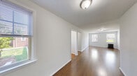 Located at 5 Market St in Clifton, NJ, this one-bedroom, one-bathroom unit offers a well-organized layout across a single floor. Rich hardwood flooring flows consistently throughout the space, lending warmth and continuity to every room.

The living area is generously proportioned and filled with natural light from large windows, creating a bright and welcoming atmosphere. A classic cast-iron radiator provides efficient heating. The layout transitions seamlessly from the living area toward the bedroom and supporting rooms via a connecting hallway.

The bedroom is a comfortable, well-lit retreat, featuring dual windows with views of the surrounding neighborhood and its own radiator. Clean white walls and hardwood floors keep the room feeling fresh and versatile.

The kitchen is efficiently designed with white cabinetry offering ample overhead storage, dark speckled countertops, a stainless steel sink, and a white gas range. A full-size refrigerator completes the space.

The bathroom is finished in classic white tile and includes a tub/shower combination, a vanity with sink, and two windows that allow natural light while maintaining privacy.

Notably, the unit features four closets spread throughout, providing exceptional storage for a residence of this size. The overall aesthetic is clean, bright, and move-in ready.