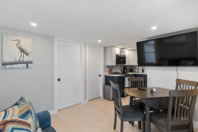 Open living space with SmarTV, complete with various streaming options. - 17 Manchester St