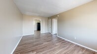 Located at 776 Bartlett Rd in Memphis, TN, this one-bedroom, one-bathroom unit offers a practical and efficient single-floor layout. Throughout the space, wood-look luxury vinyl plank flooring provides a clean, cohesive look that ties each room together. Neutral beige walls create a warm, understated backdrop across all areas.

The living room is a welcoming entry point, featuring a large window fitted with horizontal blinds that allows ample natural light to filter in alongside a front entry door. The open feel of the room provides flexibility for a variety of furniture arrangements.

The kitchen is efficiently designed with gray cabinetry, dark laminate countertops, and black appliances including a refrigerator and electric range. A notable feature is the in-unit stacked washer and dryer, conveniently integrated into the kitchen area, adding significant practical value. A textured ceiling is present in both the kitchen and living spaces.

The bedroom is a generously proportioned room, offering a comfortable retreat with a large window that brings in natural light and views of the surrounding greenery. Smooth walls and clean finishes keep the space feeling bright and airy.

The bathroom includes a full tub-shower combination with light-toned tile surround and a safety grab bar, offering both comfort and accessibility. The overall layout is compact yet thoughtfully organized, making efficient use of every square foot.