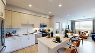 Located at 20600 North 55th Street in Phoenix, AZ, this well-appointed 2-bedroom, 2-bathroom residence offers a thoughtfully designed single-level layout. The open-concept kitchen and living area serves as the heart of the home, featuring light wood cabinetry, white lower cabinets, a clean white quartz island with bar seating, stainless steel appliances, and a white tile backsplash. Light wood-style flooring runs throughout, adding warmth and continuity to the space. The living room receives generous natural light through large windows with outdoor views, and includes recessed lighting overhead. The primary bedroom is a comfortable retreat with teal accent walls, a ceiling fan, large windows framing outdoor palm tree views, and a well-organized walk-in closet with dedicated shelving and hanging space. The second bedroom mirrors a similar bright and airy aesthetic. Both bathrooms are cleanly finished, with one featuring bold navy accent walls, a white vanity with quartz countertop, a large mirror, and wood-style flooring. A hallway connects the rooms efficiently, and two dedicated closets provide ample storage throughout. The overall ambiance is modern, bright, and cohesive, with a contemporary design sensibility suited to the Phoenix, AZ setting.