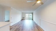 This 590 square foot apartment in Newport Beach offers a well-designed living space in a single-floor layout. The unit features a spacious 190 square foot primary bedroom, complemented by one full bathroom. The open-concept design seamlessly integrates the living room and kitchen areas, maximizing the use of space.

Throughout the apartment, warm-toned hardwood flooring adds a touch of elegance and continuity. The living area is bathed in natural light, courtesy of large sliding glass doors that lead to a private balcony, offering glimpses of the surrounding area. A wall-mounted air conditioning unit provides climate control for comfort.

The kitchen, while compact, is efficiently designed with modern appliances, including a stainless steel refrigerator and range. White cabinetry and countertops contribute to the bright, airy feel of the space. The bathroom features a full-sized bathtub with a shower, surrounded by clean, white tiling.

The bedroom, generous in size, includes a large window that allows for ample natural light and ventilation. Built-in closets with mirrored sliding doors provide storage while visually expanding the space. Overall, this apartment combines modern amenities with a thoughtful layout, creating a comfortable living environment in a prime Newport Beach location.