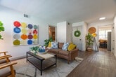 Located at 777 Mount Moriah Road in Memphis, TN, this single-floor, one-bedroom, one-bathroom unit offers a thoughtfully designed layout across six distinct spaces: a living room, kitchen, bedroom, bathroom, office, and hallway. Light wood-look flooring runs throughout, creating a cohesive and contemporary feel.

The living room is bright and open, featuring large windows that flood the space with natural light and provide outdoor views. The kitchen is outfitted with white shaker cabinetry, a herringbone tile backsplash, stainless steel appliances including a range with over-the-range microwave and full-size refrigerator, and a casual dining nook positioned beside a window.

The spacious primary bedroom includes dual closets with arched panel doors, a ceiling fan, and a natural light-filled window. The dedicated office features rich hardwood flooring, a large window with linen drapes, and ample room for a full workstation setup.

The bathroom is finished with marble-look tile surrounding the tub/shower combo, matte black fixtures, and a white vanity. A small window provides natural ventilation. The hallway connects the rooms efficiently, completing a practical and comfortable floor plan ideal for single occupancy or couples.