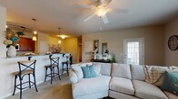 Located at 270 Meadowlark Dr in Winston-Salem, NC, this single-floor residence offers a thoughtfully designed open-concept layout that promotes a seamless flow between living spaces. The living area is generously sized, featuring plush carpeting, a ceiling fan, and large windows that fill the room with natural light while offering pleasant outdoor views. A convenient entry door provides direct access to the exterior.

The kitchen is a standout feature, showcasing rich cherry wood cabinetry, granite countertops, stainless steel appliances, and durable hardwood-style flooring. Pendant lighting and track lighting illuminate the space, while a breakfast bar with barstool seating connects the kitchen to the living and dining areas, making it ideal for both everyday living and entertaining.

The bedroom is a calm retreat with soft carpeting, a ceiling fan, and windows that bring in natural light. Ample closet space adds practicality to the room. The bathroom includes granite vanity countertops, hardwood-style flooring, and a tub/shower combination.

A dedicated laundry area with full-size washer and dryer hookups adds everyday convenience. Neutral tones and warm finishes throughout create a cohesive, welcoming ambiance across the entire residence.