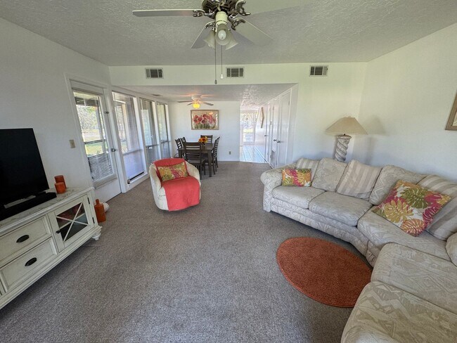 Foto del edificio - FULLY FURNISHED 2-Story Townhouse on Canal – Pool, Golf Views & ALL Utilities Included!