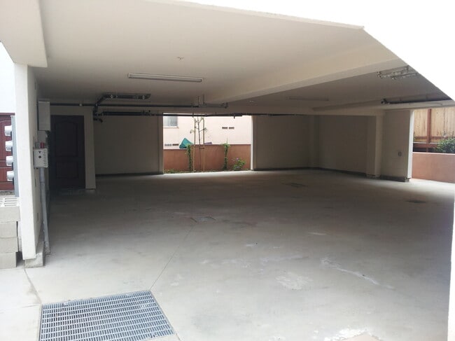 covered parking area. two tandem parking spaces - 3035-3041 Lawrence St