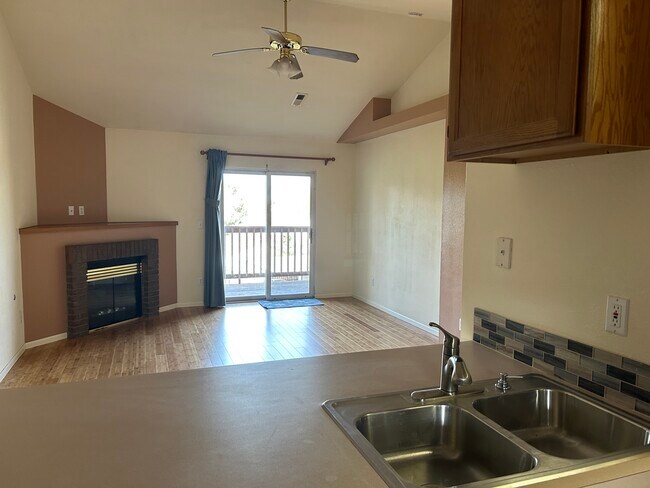 Kitchen to Living Room to balcony - 2960 W Stuart St