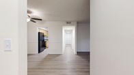 This contemporary apartment in Nashville's Legacy Hill offers 940 square feet of well-designed living space. The open floor plan seamlessly connects the living, dining, and kitchen areas, creating an airy and spacious feel. The updated kitchen boasts light wood cabinetry, granite countertops, and black appliances, including a refrigerator, range, and dishwasher.

Both bedrooms are generously sized, with the primary bedroom measuring 160 square feet. Each bedroom features ample closet space and large windows that allow natural light to flood in. The two full bathrooms are outfitted with modern fixtures, including a shower/tub combination.

Throughout the apartment, durable and attractive laminate flooring adds warmth and easy maintenance. The living room opens to a private patio or balcony through French doors, extending the living space outdoors. Additional features include ceiling fans, window blinds, and a neutral color palette that provides a blank canvas for personal decor.

With its efficient layout and contemporary finishes, this apartment offers comfortable living in a desirable Nashville location.