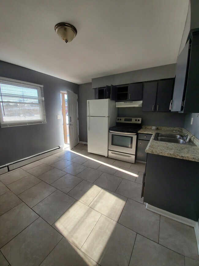 KITCHEN WITH BACK DOOR ENTRANCE - 1007 29th St