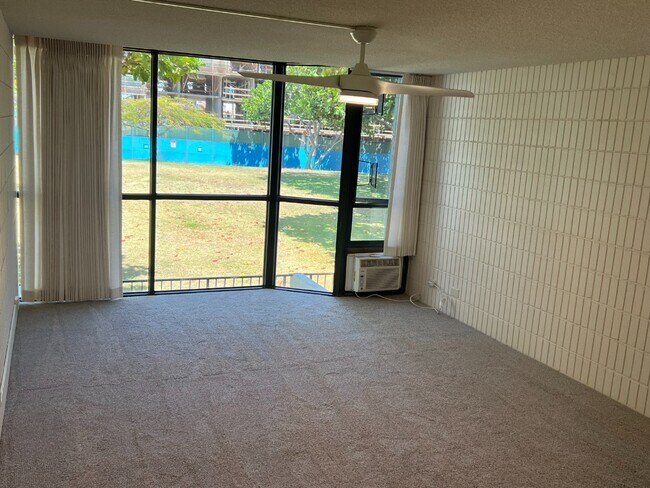 Foto del edificio - Mo?ili?ili Gem! 1-Bed Condo with Washer/Dryer, AC & Secured Parking – Available Now!