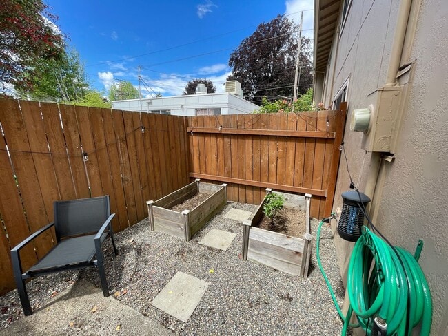 Building Photo - Stylish Corner Condo In Prime Location w/ Parking, Private Outdoor Space & W/D