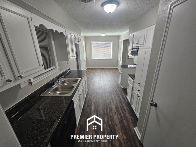 Building Photo - Newly Renovated 4BR Memphis Home | Brick Fireplace, 2-Car Garage & Fenced Backyard