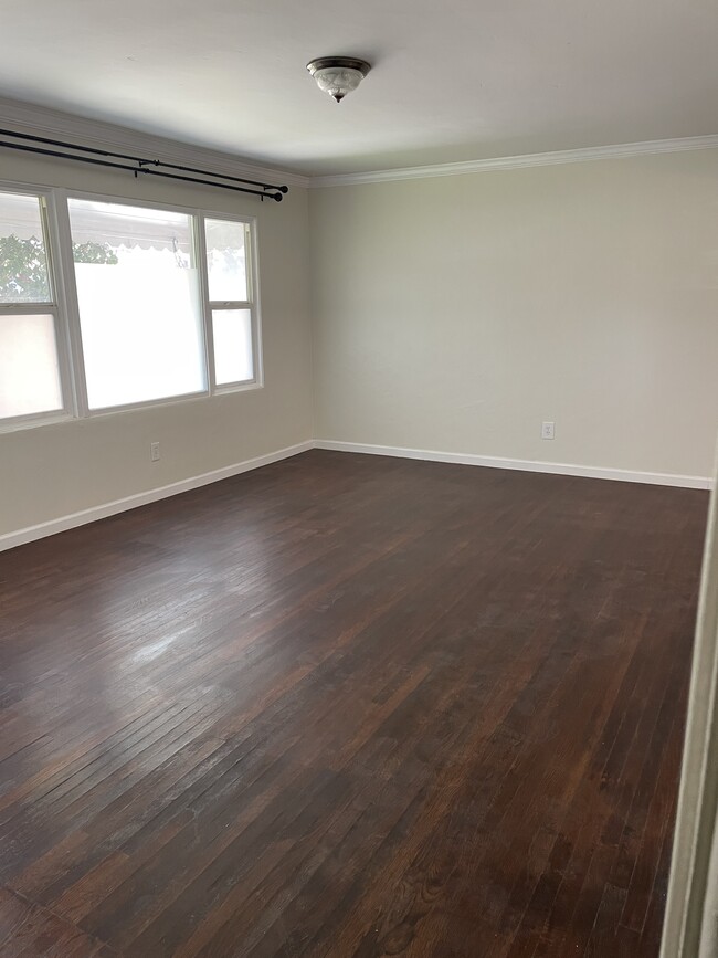 Entryway/Livingroom. The Frosted windows are removeable but give nice privacy - 525 Jefferson Ave