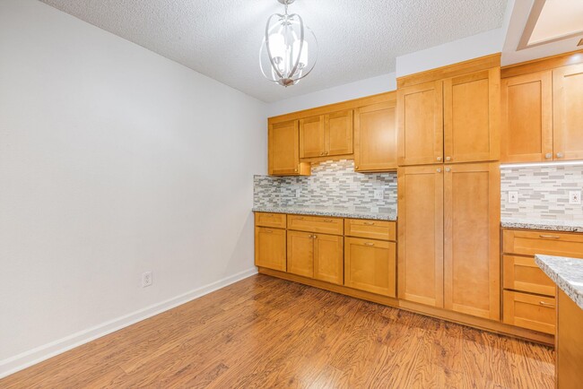 Building Photo - Sweet & Cozy 2/1 condo available in Mt. Park with covered parking, in-unit laundry, outdoor pool ...