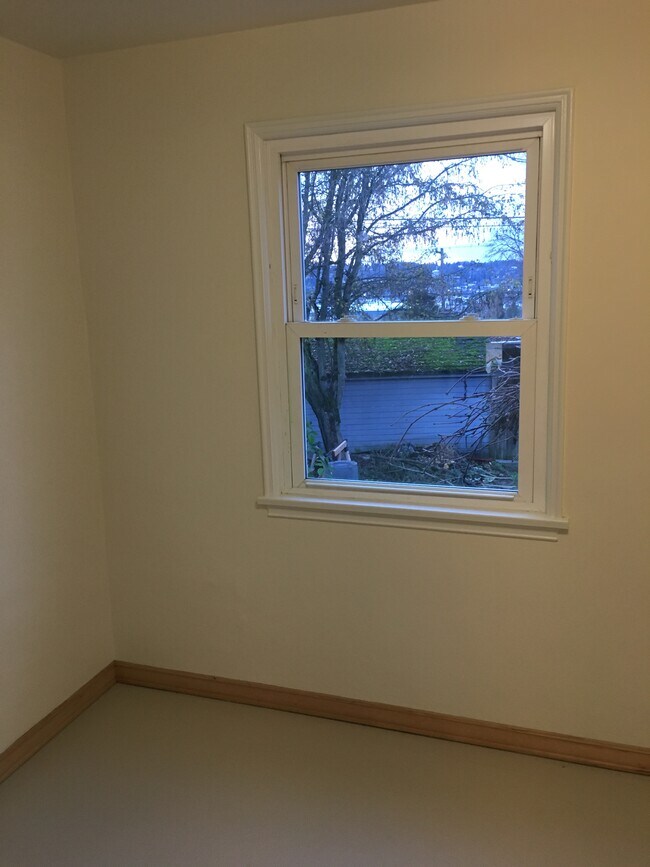 Bedroom #2 with western &amp; southern exposure, view into back yard - 4335 Baker Ave NW