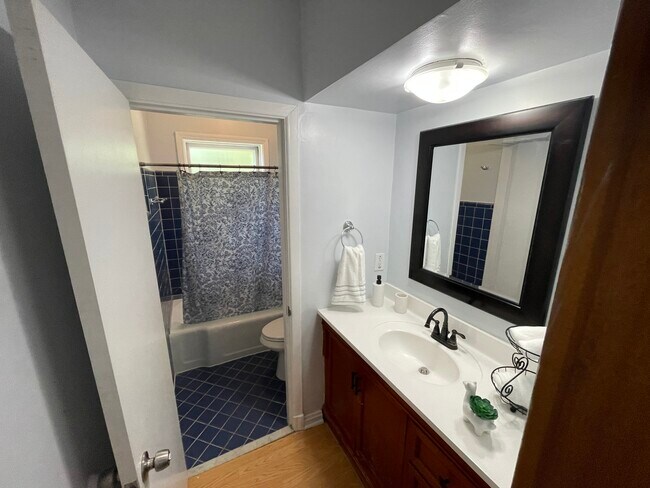 Guest full bath, separate door allows sink use by others - 8100 Balson Ave