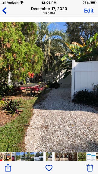 The shell driveway and pathway takes you to your gated entrance. - 5703 Murdock Ave