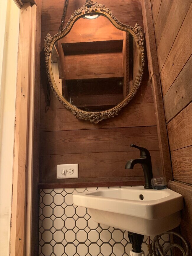 Tiny half bath under stair case - 416 W Milton Ave